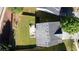 Aerial view of a home showcasing a spacious backyard, patio, and surrounding greenery at 2984 Gayle Manor Ln, Snellville, GA 30078