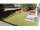 Spacious backyard featuring well-maintained lawn, patio with outdoor furniture, and privacy fence at 2984 Gayle Manor Ln, Snellville, GA 30078