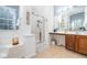Stylish bathroom with a soaking tub, glass-enclosed shower, and double vanity at 2984 Gayle Manor Ln, Snellville, GA 30078