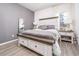 Bedroom with a large bed, matching nightstands, neutral walls, and a cozy atmosphere at 2984 Gayle Manor Ln, Snellville, GA 30078
