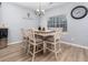 Cozy dining room featuring a table with four chairs, stylish chandelier, and a bright window at 2984 Gayle Manor Ln, Snellville, GA 30078
