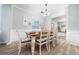 Bright dining area with a table for eight and a view to the adjacent rooms at 2984 Gayle Manor Ln, Snellville, GA 30078