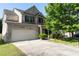 Charming brick two-story home with an attached garage and a well-maintained front yard at 2984 Gayle Manor Ln, Snellville, GA 30078