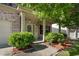 Welcoming entryway of brick home with beautiful landscaping and manicured bushes at 2984 Gayle Manor Ln, Snellville, GA 30078