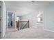 Upstairs hallway with natural light and access to various bedrooms, offering a spacious and well-lit passage at 2984 Gayle Manor Ln, Snellville, GA 30078