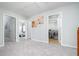 Hallway with access to multiple rooms including the laundry area, providing convenient access to different spaces at 2984 Gayle Manor Ln, Snellville, GA 30078