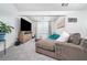 Relaxing living room with a large television, comfortable sofa, and natural light at 2984 Gayle Manor Ln, Snellville, GA 30078