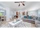 Open concept living room with an archway to the dining area, providing an ideal space for entertaining at 2984 Gayle Manor Ln, Snellville, GA 30078