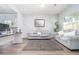 Inviting living room with grey walls, hardwood floors, and natural lighting at 2984 Gayle Manor Ln, Snellville, GA 30078
