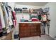 Well-organized walk-in closet features a dresser, shelving, and ample hanging space at 2984 Gayle Manor Ln, Snellville, GA 30078