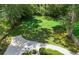 Aerial view of a large backyard featuring lush green grass and driveway at 389 Valley Brook Ne Dr, Atlanta, GA 30342