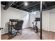Finished basement gym with exercise bike, laminate flooring, and home office at 389 Valley Brook Ne Dr, Atlanta, GA 30342