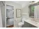Stylish bathroom features a gray vanity, updated fixtures, and subway tile walls at 389 Valley Brook Ne Dr, Atlanta, GA 30342