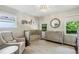 Bright Bedroom featuring a crib, changing table, a large window, and decorative wall art at 389 Valley Brook Ne Dr, Atlanta, GA 30342