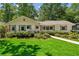 Charming single story home with a well-maintained front lawn and mature landscaping at 389 Valley Brook Ne Dr, Atlanta, GA 30342
