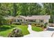 Well-maintained home featuring manicured lawn and walkway leading to front door with mailbox at end of drive at 389 Valley Brook Ne Dr, Atlanta, GA 30342