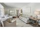 Bright living room featuring hardwood floors, neutral paint, stylish furniture, and a large window at 389 Valley Brook Ne Dr, Atlanta, GA 30342