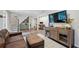 Open living room showcasing hardwood floors, entertainment center and a comfortable leather sofa at 389 Valley Brook Ne Dr, Atlanta, GA 30342