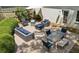 Brick patio featuring comfortable outdoor seating, dining table, and shade umbrella at 389 Valley Brook Ne Dr, Atlanta, GA 30342