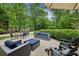 Brick patio featuring outdoor seating, dining table, and basketball court at 389 Valley Brook Ne Dr, Atlanta, GA 30342