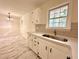Kitchen showcases sleek countertops, stylish backsplash, and modern faucet with natural light at 398 Windy Hill Se Rd, Marietta, GA 30060