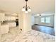 Open layout connects kitchen with dining and living areas, complemented by modern flooring and finishes at 398 Windy Hill Se Rd, Marietta, GA 30060
