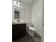 Bathroom featuring a vanity with dark wood cabinets and a toilet at 4485 Golf Vista Cir, Decatur, GA 30035