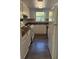 A kitchen featuring white cabinets, countertops, and essential appliances at 4485 Golf Vista Cir, Decatur, GA 30035
