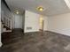 Open living room area with wood-look flooring, stairs, and neutral paint at 4485 Golf Vista Cir, Decatur, GA 30035
