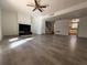 Spacious living room with wood-look flooring, ceiling fan, and fireplace at 4485 Golf Vista Cir, Decatur, GA 30035