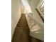 Carpeted stairway with white railing leading to the upper level of the home at 4485 Golf Vista Cir, Decatur, GA 30035