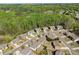 Aerial view showcasing the home's position within a tranquil, tree-lined neighborhood setting at 4735 Belcrest Way, Cumming, GA 30040