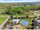 Overhead view of community amenities including a pool and tennis courts with landscaped surroundings at 4735 Belcrest Way, Cumming, GA 30040