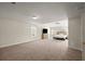 Large primary bedroom boasts neutral walls, carpet, and ample natural light from two windows at 4735 Belcrest Way, Cumming, GA 30040