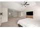 Large bedroom features neutral walls, carpet, natural light, vaulted ceiling and TV at 4735 Belcrest Way, Cumming, GA 30040