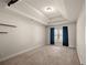 Inviting bedroom with dark curtains and tray ceilings at 4735 Belcrest Way, Cumming, GA 30040