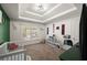 Bright bedroom features a tray ceiling, large window, neutral walls, and a well-organized storage area at 4735 Belcrest Way, Cumming, GA 30040