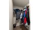 Walk-in closet with ample hanging space and shelving for clothing storage at 4735 Belcrest Way, Cumming, GA 30040