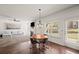 Bright, open-concept dining and living area featuring hardwood floors and ample natural light at 4735 Belcrest Way, Cumming, GA 30040