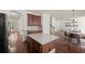 Gourmet kitchen with granite island adjoins the dining and living areas, perfect for entertaining at 4735 Belcrest Way, Cumming, GA 30040