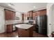 Bright kitchen features stainless steel appliances, granite countertops, and a central island at 4735 Belcrest Way, Cumming, GA 30040