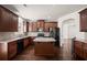 Spacious kitchen with stainless steel appliances, granite counters, and a dark hardwood flooring at 4735 Belcrest Way, Cumming, GA 30040