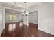 Spacious living room with hardwood floors, white trim, and an open layout at 4735 Belcrest Way, Cumming, GA 30040