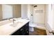 Modern bathroom features tiled walk-in shower with dark wood vanity and white countertop at 1333 Briar Ridge Ln, Jonesboro, GA 30238