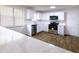 Modern kitchen with stainless steel appliances, quartz countertops, and a sink with natural light at 1333 Briar Ridge Ln, Jonesboro, GA 30238