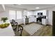 Bright kitchen with white cabinets, stainless steel appliances, and modern countertops for cooking at 1333 Briar Ridge Ln, Jonesboro, GA 30238