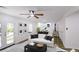 Open living room featuring a comfortable white sofa, contemporary decor, and access to outdoor views at 1333 Briar Ridge Ln, Jonesboro, GA 30238