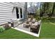 Relax on the patio featuring a grill, seating and serene views of the landscaped backyard at 1333 Briar Ridge Ln, Jonesboro, GA 30238