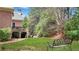 A beautiful, multi-tiered back yard and deck with seating area at 2016 Westbourne Way, Johns Creek, GA 30022