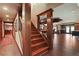 Basement stairs leading to finished entertainment area with custom bar at 2016 Westbourne Way, Johns Creek, GA 30022